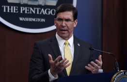 (FILES) In this file photo taken on March 4, 2020, US Secretary of Defense Mark Esper speaks during a press conference at the Pentagon in Washington, DC. - The United States will slash its military presence in Germany by 11,900 troops, relocating some to Italy and Belgium in a major shift of Washington's NATO assets, Defense Secretary Mark Esper announced on July 29, 2020. In a repositioning that could start within weeks, the Pentagon will be sending home about 6,400 of its military personnel in Germany, and move nearly 5,600 to other NATO countries. (Photo by Olivier DOULIERY / AFP)