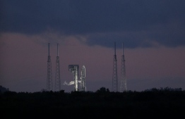 An Atlas V rocket with the Perseverance rover is seen at Launch Complex 41 at Cape Canaveral Air Force Station in Florida before sunrise on July 30, 2020. - The Perseverance rover will seek signs of ancient life on Mars and collect rock and soil samples for possible return to Earth. The Atlas V is one of the largest rockets available for interplanetary flight, having also launched the InSight and Curiosity to Mars. The launch vehicle is provided by United Launch Alliance. Perseverance is scheduled to arrive at the Jezero Crater on Mars on February 18, 2021. It will also carry the Mars Helicopter as part of a technology demonstration. (Photo by Gregg Newton / AFP)