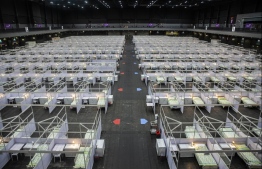 Rows of beds are seen at a temporary field hospital set up at Asia World Expo in Hong Kong on August 1, 2020. - Hong Kong opened a temporary field hospital with 500 beds on August 1 to house stable COVID-19 patients as the city saw new wave of virus outbreak and postponed its legislative elections citing public health reason. PHOTO: ISAAC LAWRENCE / AFP