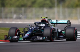 Mercedes' Finnish driver Valtteri Bottas steers his car during the qualifying session for the Formula One British Grand Prix at the Silverstone motor racing circuit in Silverstone, central England on August 1, 2020. PHOTO: BRYN LENNON / POOL / AFP