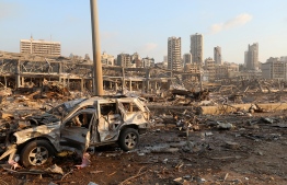 A damaged vehicle is seen at the site of an explosion in Beirut, Lebanon August 4, 2020. REUTERS/Mohamed Azakir