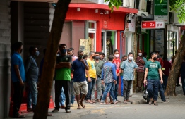 (FILE) Bangladeshi workers queuing to register to leave Maldives due to unavailability of jobs in the pandemic, on August 9, 2020 -- Photo: Ahmed Awshan Ilyas / Mihaaru