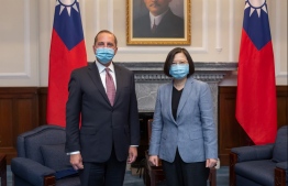 This handout photo taken and released by the Taiwan Presidential Office on August 10, 2020 showing Taiwan's President Tsai Ing-wen (R) posing for photos with US Secretary of Health and Human Services Alex Azar (L) during his visit to the Presidential Office in Taipei. - The US cabinet member met Taiwan's leader on August 10 during the highest level visit from the United States since it switched diplomatic recognition from the island to China in 1979, a trip that Beijing has condemned. (Photo by Handout / Taiwan Presidential Office / AFP) / -----EDITORS NOTE --- RESTRICTED TO EDITORIAL USE - MANDATORY CREDIT "AFP PHOTO / TAIWAN PRESIDENTIAL OFFICE" - NO MARKETING - NO ADVERTISING CAMPAIGNS - DISTRIBUTED AS A SERVICE TO CLIENTS