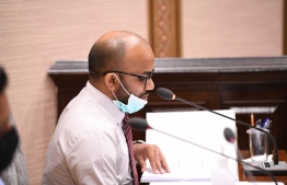 Minister of Finance Ibrahim Ameer speaking at a Parliament session. PHOTO: PARLIAMENT