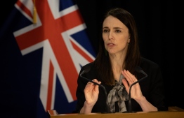 New Zealand's Prime Minister Jacinda Ardern speaks to media at the parliament in Auckland on August 12, 2020. (Photo by Marty MELVILLE / AFP)