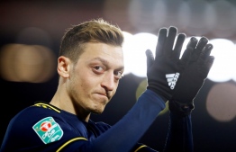 German-born footballer Mesut Ozil makes an appreciative gesture, whilst at a match in August 2020. PHOTO: AFP