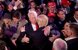 (FILES) In this file photo taken on November 09, 2016 Republican president-elect Donald Trump (front) hugs his brother Robert Trump after delivering his acceptance speech in New York City. - Donald Trump's younger brother Robert died on August 15 after being hospitalized for an undisclosed illness, the US president said in a statement.
"It is with heavy heart I share that my wonderful brother, Robert, peacefully passed away tonight," Trump said in a White House statement.  PHOTO: CHIP SOMODEVILLA / GETTY IMAGES NORTH AMERICA / AFP