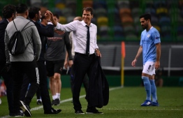 Lyon's French coach Rudi Garcia celebrates his team's win at the end of the UEFA Champions League quarter-final football match between Manchester City and Lyon at the Jose Alvalade stadium in Lisbon on August 15, 2020. PHOTO: FRANCK FIFE / AFP