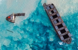 An aerial view taken in Mauritius on August 17, 2020, shows the MV Wakashio bulk carrier, belonging to a Japanese company but Panamanian-flagged, that had run aground and broke into two parts near Blue Bay Marine Park. (Photo by - / AFP)