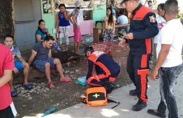 Rescuers treat an injured resident (L) after a 6.7-magnitude earthquake hit near the town of Cataingan in the central Philippine province of Masbate on August 18, 2020. - The strong earthquake shook the central Philippines on August 18, sending residents fleeing their homes and damaging buildings and roads, with at least one person reported killed. (Photo by Christopher Decamon / AFP)