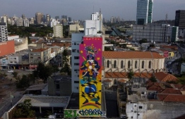 (FILES) In this file photo taken on August 13, 2020 aaerial view of graffitis on buildings as part of the first edition of the NaLata International Art Festival which has 15 national and international artists of urban art at Largo da Batata, in Sao Paulo, Brazil. - The festival wants to make Sao Paulo as the world capital of graffiti. (Photo by Miguel SCHINCARIOL / AFP)