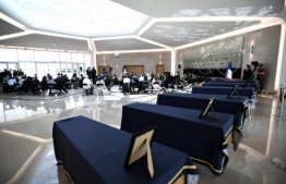 This picture taken on August 14, 2020, shows the coffins of the six humanitarian aid workers from the French NGO Acted killed in an attack in Niger during a ceremony at an airport lounge transformed into a funeral home at the Orly Airport, south of Paris. - France pledged to ramp up security for its nationals in the Sahel region following an attack in Niger on August 9, 2020 in which eight people, six of them French, were murdered by jihadists, in Koure National Park, just 60 kilometres (37 miles) from the Nigerien capital of Niamey. The killings were the first by jihadist gunmen in that area, a destination for weekend leisure trips by Niamey residents, including foreigners. (Photo by STEPHANE DE SAKUTIN / various sources / AFP)