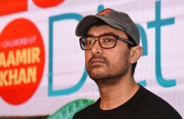 (FILES) In this file photo taken on March 27, 2019 Indian Bollywood actor Aamir Khan looks on during the launch of a book about weight loss in Mumbai. - Khan, a Muslim, has long been a hate figure for India's Hindu far-right but now they have a new line of attack: his massive popularity in China. Prime Minister Narendra Modi's government has fanned growing hostility to China following a deadly clash on their disputed Himalayan border on June 13. (Photo by Sujit Jaiswal / AFP)