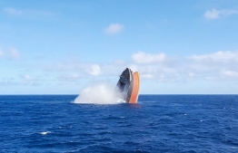 This handout picture taken on August 24, 2020, by the Mauritius Police Press Office shows the broken stem of the MV Wakashio, a Japanese-owned ship which ran aground causing a devastating oil spill, sinking in the open water near Mauritius. - The MV Wakashio ran aground on a coral reef off the Indian Ocean island on July 25, 2020, and began leaking oil two weeks later, prompting a race against the clock to pump all the fuel off the bulk carrier before it broke in two. The operation was successful and two tugboats last week began towing the larger, forward section of the vessel some 15 kilometres (nine miles) out into the open ocean, where it has been sunk to a depth of 3,180 metres. (Photo by - / Mauritius Police Press Office / AFP) / 