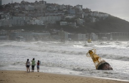 A general view shows a buoy that was un-tethered during heavy swell brought by Typhoon Maysak overnight on Haeundae beach in Busan on September 3, 2020. - At least one person was killed and more than 2,000 people evacuated to temporary shelters in South Korea as a powerful typhoon churned across the peninsula, authorities said. (Photo by Ed JONES / AFP)