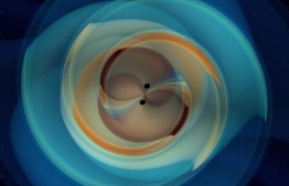 This handout image released by The Max Planck Institute for Gravitational Physics on September 2, 2020, shows a simulation of a Binary black hole merger GW190521 (numerical relativistic simulation). - It took 7 billion light years to reach us: a massive black hole of a new type, probably resulting from the fusion of two black holes, was directly observed for the first time thanks to gravitational waves, two studies revealed on September 2, 2020. (Photo by MAX PLANCK INSTISTUTE FOR GRAVITATIONAL PHYSICS / AFP) / 