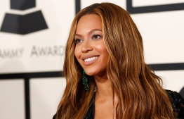 Pop queen Beyonce's "Black Is King" musical film propelled her to the front of this year's Grammy pack with nine nominations, organizers said Tuesday ahead of the annual awards show.
Robyn BECK / AFP