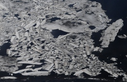 (FILES) In this file photo ice breaks up early on the Kuskokwim River beside the Bering Sea and near the climate change affected Yupik Eskimo village of Quinhagak on the Yukon Delta in Alaska on April 12, 2019. - Winter ice in the Bering Sea, in the northern Pacific Ocean between Alaska and Russia, is at its lowest levels for 5,500 years, according to a study released on September 2, 2020.  Researchers analyzed vegetation that accumulated on the uninhabited island of St Matthew over the last five millennia. (Photo by Mark RALSTON / AFP)