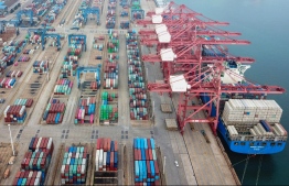 (FILES) This file photo taken on July 14, 2020 shows containers stacked at a port in Lianyungang in China's eastern Jiangsu province. - China's exports expanded more than expected in August, 2020 as key markets eased virus containment measures, official data showed on September 7, but imports unexpectedly shrank despite a push to boost domestic demand. (Photo by STR / AFP) / 