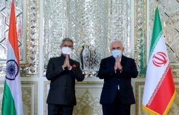 A handout picture provided by the Iranian Foreign Ministry on September 8, 2020 shows Foreign Minister Mohammad Javad Zarif (R) welcoming his Indian counterpart Subrahmanyam Jaishankar at the ministry headquarters in the capital Tehran. (Photo by - / Iranian Foreign Ministry / AFP) / 