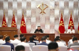 This picture taken on September 8, 2020 and  released from North Korea's official Korean Central News Agency (KCNA) on September 9, 2020 shows North Korean leader Kim Jong Un attending a conference with the Central Military Commission of the Workers' Party of Korea on damages inflicted by Typhoon Maysak in South and North Hamgyong Province, at the headquarters of Central Committee of the Workers' Party of Korea, in Pyongyang. PHOTO: STR / KCNA / KNS / AFP