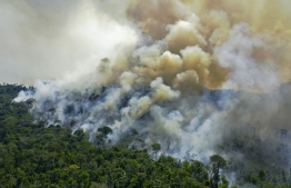 (FILES) Aerial file photo taken on August 16, 2020 of an area of Amazon rainforest reserve burning south of Novo Progresso, in Para state, Brazil. - The number of fires in the Brazilian Amazon last month was the second-highest in a decade for August, nearing the crisis levels that unleashed a flood of international condemnation last year, official figures showed on September 1, 2020. (Photo by CARL DE SOUZA / AFP)