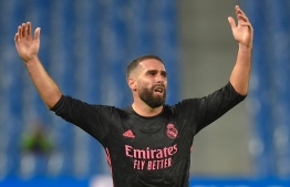 Real Madrid's Spanish defender Daniel Carvajal gestures at the end of the Spanish league football match between Real Sociedad and Real Madrid at the Anoeta stadium in San Sebastian on September 20, 2020. (Photo by ANDER GILLENEA / AFP)