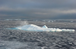 (FILES) In this September 23, 2015 file photo, ice chunks are seen in the Northwest Passage near the CCGS Amundsen, a Canadian research ice-breaker navigating in the Canadian High Arctic. - Arctic summer sea ice melted in 2020 to the second smallest area since records began 42 years ago, US scientists announced on September 21, 2020, offering further stark evidence of the impact of global warming. Artic sea ice melts in summer and reforms in winter, but precise satellite imagery taken regularly since 1979 had documented how the cycle has been shrinking significantly.The year's minimum was reached on September 15, at 3.74 million square kilometers (1.44 million square miles), according to scientists at the National Snow and Ice Data Center (NSIDC) at the University of Colorado Boulder. (Photo by Clement Sabourin / AFP)
