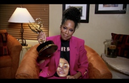 This handout screen shot released courtesy of American Broadcasting Companies, Inc. / ABC shows US actress Regina King wearing a Breonna Taylor shirt as she wins the Emmy for Outstanding Lead Actress In A Limited Series Or Movie with Watchmen during the 72nd Primetime Emmy Awards on September 20, 2020. - Hollywood's first major Covid-era award show will look radically different to previous editions, with no red carpet and a host broadcasting from an empty theater in Los Angeles, which remains under strict lockdown. (Photo by - / American Broadcasting Companies, Inc. / ABC / AFP) / RESTRICTED TO EDITORIAL USE - MANDATORY CREDIT "AFP PHOTO / American Broadcasting Companies, Inc. / ABC" - NO MARKETING NO ADVERTISING CAMPAIGNS - DISTRIBUTED AS A SERVICE TO CLIENTS --- NO ARCHIVE --- / TABLOIDS OUT; NO BOOK PUBLISHING WITHOUT PRIOR APPROVAL. NO ARCHIVE. NO RESALE.