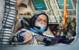 Russian cosmonaut Sergey Ryzhikov, member of the International Space Station (ISS) expedition 64, attends his final exam at the Gagarin Cosmonauts' Training Centre in Star City outside Moscow on September 23, 2020. - Sergey Ryzhikov and Sergey Kud-Sverchkov of Russian space agency Roscosmos and NASA astronaut Kate Rubins are preparing for the launch onboard the Soyuz MS-17 spacecraft from the Russian-leased Kazakh Baikonur cosmodrome on October 14. (Photo by Andrey SHELEPIN / Russian Space Agency Roscosmos / AFP) / 