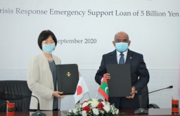 Ambassador of Japan to Maldives Keiko Yanai (L) and Minister of Foreign Affairs Abdulla Shahid sign the Exchange of Notes for the 'COVID-19 Crisis Response Emergency Support Loan' worth USD 47.5 million extended by Japan to Maldives. PHOTO/FOREIGN MINISTRY