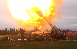 An image grab taken from a video made available on the official web site of the Azerbaijani Defence Ministry on September 28, 2020, allegedly shows Azeri artillery strike towards the positions of Armenian separatists in the breakaway region of Nagorno-Karabakh. (Photo by Handout / Azerbaijani Defence Ministry / AFP)