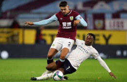 Burnley's English defender Matthew Lowton (L) vies with Manchester City's English midfielder Raheem Sterling (R) during the English League Cup fourth round football match between Burnley and Manchester City at Turf Moor in Burnley, north west England on September 30, 2020. (Photo by MOLLY DARLINGTON / POOL / AFP)