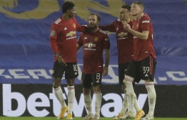 Manchester United's Spanish midfielder Juan Mata (2L) celebrates with teammates after he scores his team's second goal during the English League Cup fourth round football match between Brighton and Hove Albion and Manchester United at the American Express Community Stadium in Brighton, southern England on September 30, 2020. (Photo by Matt Dunham / POOL / AFP)