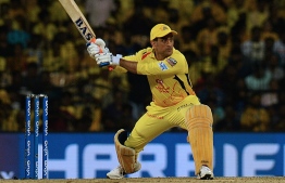 In this file photo taken on May 7, 2019, Chennai Super Kings cricket captain Mahendra Singh Dhoni plays a shot during the 2019 Indian Premier League (IPL) first qualifier Twenty20 cricket match between Chennai Super Kings and Mumbai Indians at the M.A. Chidambaram Stadium in Chennai. - India's Mahendra Singh Dhoni has become the most-capped IPL player even as his Chennai Super Kings team -- currently bottom of the table -- faltered in yet another run chase. (Photo by ARUN SANKAR / AFP)