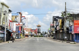 A general view shows a deserted street in Minuwangoda on the outskirts of the Sri Lankan capital of Colombo on October 4, 2020, as police imposed a curfew on the towns of Minuwangoda and Divulapitiya following the discovery of a coronavirus patient, the first case reported from the community after several weeks. -- Photo: Ishara S. Kodikara / AFP