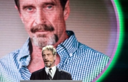 (FILES) In this file photo taken on August 16, 2016 John McAfee, founder of the eponymous anti-virus company, speaks during the China Internet Security Conference in Beijing. - McAfee was arrested on October 3, 2020 at Barcelona's El Prat airport, when he was going to travel to Istanbul, police sources told AFP. (Photo by Fred DUFOUR / AFP)
