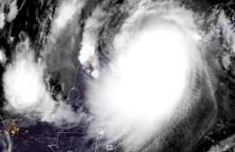 This RAMMB/NOAA satellite image shows Hurricane Delta moving towards Mexico's Caribbean coast on October 7, 2020, at 11:40 UTC. - Hurricane Delta slammed into Mexico's Caribbean coast early October 7, 2020 packing maximum winds of 110 mph (175 kph), US forecasters said. A weakened Delta hit the Yucatan Peninsula near the city of Puerto Morelos as a Category 2 storm, the National Hurricane Center said.Thousands of tourists had hunkered down in emergency shelters in a string of major beach resorts as the storm approached with a potentially life-threatening storm surge. (Photo by Handout / RAMMB/NOAA/NESDIS / AFP) / 