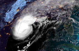 This National Oceanic and Atmospheric Administration satellite image shows Hurricane Delta moving towards the US on October 9, 2020, at 12:21UTC. - Delta was packing sustained winds of 120 miles per hour (195 kph), the US National Hurricane Center (NHC) said, with landfall expected October 9 in the evening. It is now a Category 3 storm, which means "devastating damage" may occur, according to the NHC. (Photo by Handout / NOAA/GOES / AFP) / 
