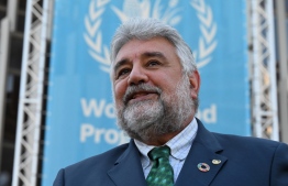 Deputy Executive Director Amir Mahmoud Abdulla gestures as he speaks to media representatives outside The World Food Programme (WFP) headquarters in Rome on October 9, 2020, after the announcement that the organisation had been awarded the Nobel Peace Prize. - World Food Programme chief David Beasley said that the UN agency was "deeply humbled" by winning the Nobel Peace Prize, adding it had rendered him "speechless". (Photo by Alberto PIZZOLI / AFP)