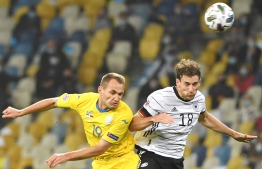 Ukraine's Yevhen Makarenko and Germany's Leon Goretzka vie for the ball during the UEFA Nations League football match between Ukraine and Germany at the Olympiyskiy stadium in Kiev on October 10, 2020. (Photo by Sergei SUPINSKY / AFP)