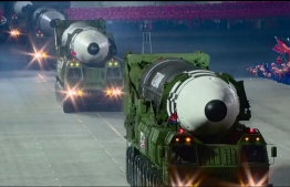 A screen grab taken from a KCNA broadcast on October 10, 2020 shows what appears to be new North Korean intercontinental ballistic missiles during a military parade marking the 75th anniversary of the founding of the Workers' Party of Korea, on Kim Il Sung square in Pyongyang. - Nuclear-armed North Korea held a giant military parade, television images showed, with thousands of maskless troops defying the coronavirus threat and Pyongyang expected to put on show its latest and most advanced weapons. (Photo by - / KCNA / AFP)