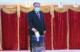 Tajik President and presidential candidate Emomali Rakhmon casts his ballot at a polling station during Tajikistan's presidential election in Dushanbe on October 11, 2020, amid the ongoing coronavirus disease pandemic. (Photo by Handout / Press Service of the President of the Republic of Tajikistan / AFP) / 
