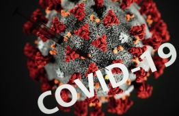 This photograph taken on October 7, 2020 shows a syringe on an illustration representing Covid-19 (novel coronavirus), in Toulouse, southwestern France. (Photo by Lionel BONAVENTURE / AFP)