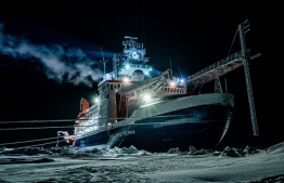 (FILES) This file photo shows a handout picture released on May 27, 2020 by the Alfred-Wegener-Institute and taken on January 1, 2020 with the German research icebreaker "Polarstern" in the Central Arctic Ocean during polar night. - Researchers on the world's biggest polar mission saw first-hand how climate change is destroying the Arctic's ice sheets, the head of the mission told AFP as it prepared to dock in Germany on Monday, October 12, 2020. (Photo by Lukas PIOTROWSKI / Alfred Wegener Institut / AFP)