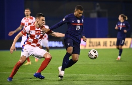 France's forward Kylian Mbappe (R) vies for the ball with Croatia's defender Filip Uremovic  during the UEFA Nations League Group A3 football match between Croatia and France at the Maksimir Stadium in Zagreb on October 14, 2020. (Photo by FRANCK FIFE / AFP)
