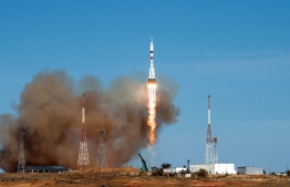 The Soyuz MS-17 spacecraft carrying the International Space Station (ISS) expedition 64 crew of NASA astronaut Kate Rubins and Russian cosmonauts Sergey Ryzhikov and Sergey Kud-Sverchkov blasts off to the ISS from the Russian-leased Baikonur cosmodrome in Kazakhstan on October 14, 2020. (Photo by Andrey SHELEPIN / Russian Space Agency Roscosmos / AFP) / 