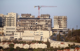 A picture taken on October 14, 2020, shows new buildings in the Israeli settlement of Efrat south of the city of Bethlehem in the occupied West Bank. (Photo by HAZEM BADER / AFP)