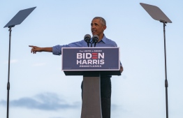 Former US President Barack Obama addresses Biden-Harris supporters during a drive-in rally in Philadelphia, Pennsylvania on October 21, 2020. - Former US president Barack Obama hit the campaign trail for Joe Biden today in a bid to drum up support for his former vice president among young Americans and Black voters in the final stretch of the White House race. (Photo by Alex Edelman / AFP)