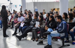 (FILES) In this file photo taken on June 11, 2019 unemployed people wait for their turn to get information on job opportunities at the Workers Service Department (CAT) in Sao Paulo, Brazil. - Unemployment rate increased in Brazil reaching a 14,4% in the June-August trimester, a record since the beginning of the historic series in 2012, informed the Brazilian Institute of Statistics (IBGE) on October 30, 2020. (Photo by NELSON ALMEIDA / AFP)